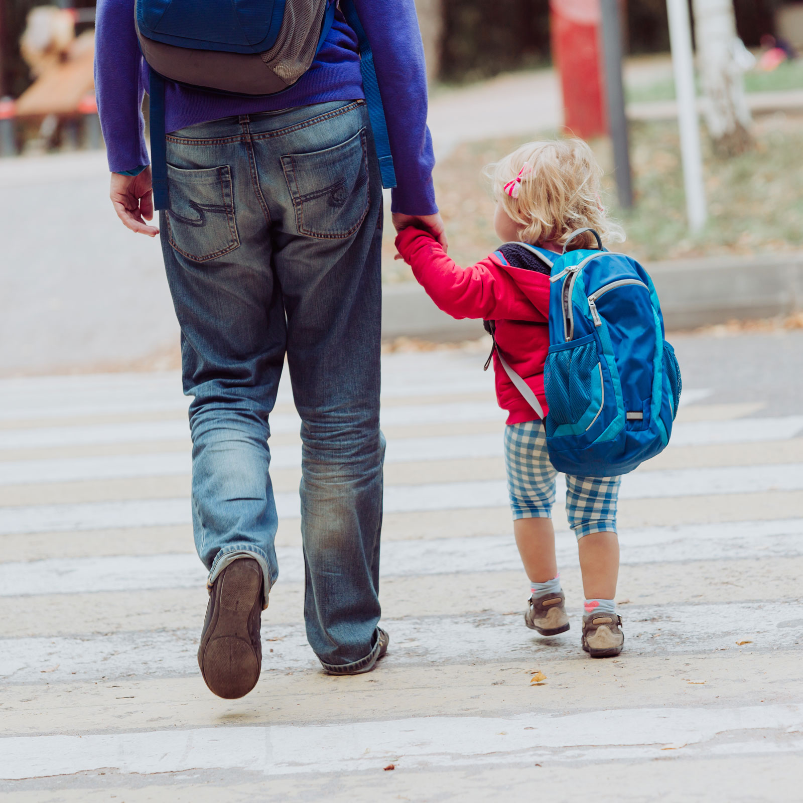dad walking daughter to preschool